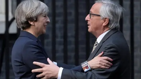 Reuters Theresa May and Jean-Claude Juncker
