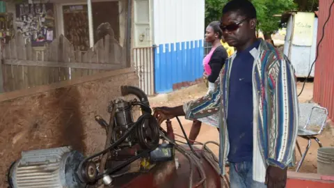 Francis Ahiale Francis Ahiale in his tyre workshop