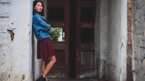 Aliya Shagieva Aliya Shagieva portrait in a doorway