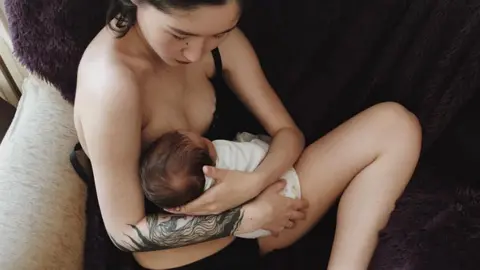 Aliya Shagieva The picture of Aliya Shagieva breastfeeding in her underwear that sparked the debate