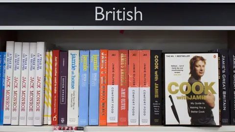 Getty Images Bookshelf dominated by Jamie Oliver books