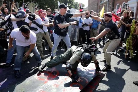 Chip Somodevilla/ Getty Images People clash at a rally in America.