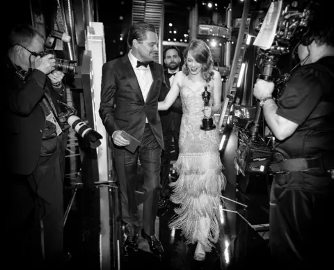 Christopher Polk/ Getty Images Leonardo DiCaprio and Emma Stone backstage.
