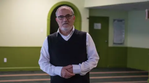 AFP/Getty Images Mohamed Labidi stands inside the mosque's prayer room