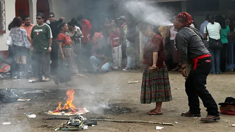 ZUMA Press, Inc./Alamy Outside the Temple of San Simón, shamans regularly perform rituals to vanquish negative energy (Credit: ZUMA Press, Inc./Alamy)