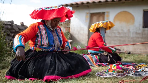 Getty Images Peruvian women use traditional weaving techniques to make products for a not-for-profit social enterprise (Credit: Getty Images)