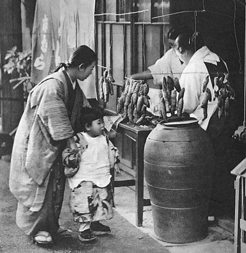 Chronicle/Alamy Stock Photo As yaki-imo became a staple winter food, sweet potato specialty stores and vendors boomed in the early 20th Century (Credit: Chronicle/Alamy Stock Photo)