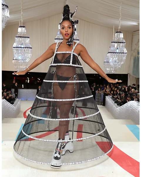 Getty Images Janelle Monáe's structured sheer dress over a sparkly bikini, worn to the Met Gala, created an empowered look (Credit: Getty Images)