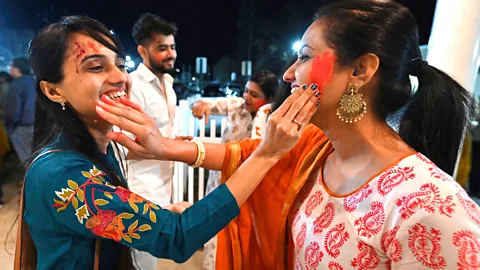 Getty Images Women enjoying Holi festival in the US