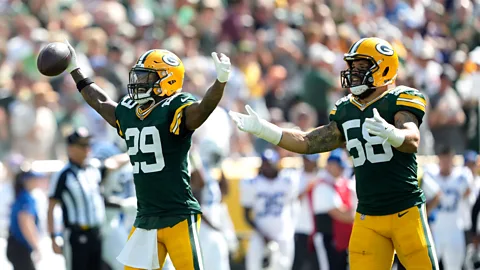 Getty Images Finding out someone likes the same sports team as us, Bob Cialdini says, may make them more favourable in our eyes (Credit: Getty Images)