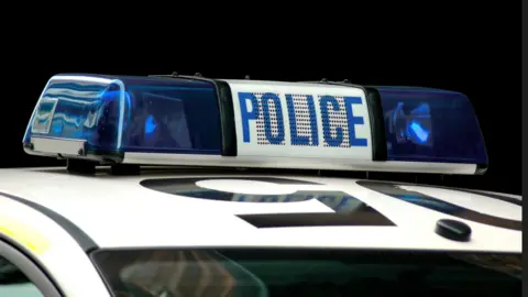 Getty Images A blue light on the roof of a police car