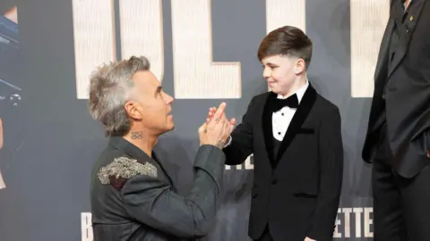 PA Media Robbie Williams at the European premiere of his new film Better Man,  Carter J. Murphy and Jonno Davies attending the European premiere for Better Man at Odeon Luxe, Leicester Square, London.