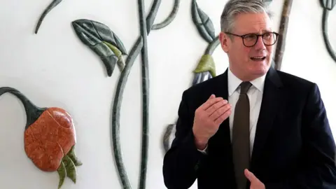 Reuters Britain's Prime Minister Keir Starmer visits the Sheikh Zayed Grand Mosque in Abu Dhabi, United Arab Emirates, on 9 December 2024