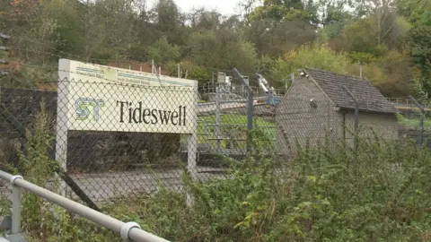 Tideswell Sewage works. A small site with barbed wire in the middle of the Peak District
