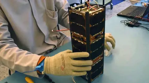 Sky and Space Global Still from video of a nano-satellite being assembled by hand