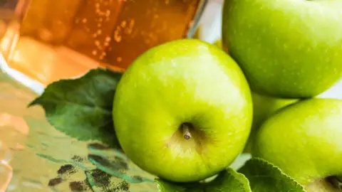 Getty Images Apples and juice