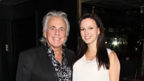 Getty Images Peter Stringfellow and wife Bella in 2013