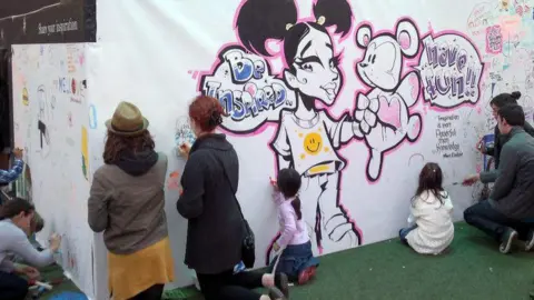 Darren Cullen Children taking part in a graffiti workshop.