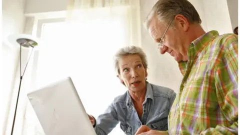 Getty Images An older couple with a computer