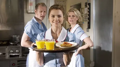 Moviestore/Shutterstock Keri Russell (centre) with Lew Temple and Cheryl Hines in Waitress