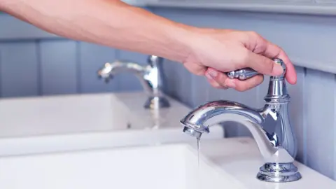Getty Images Turning off a tap
