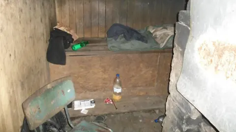 Derbyshire Police A shack in Latvia where a victim was housed in freezing temperatures
