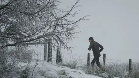 Getty Images A fell runner in the snow