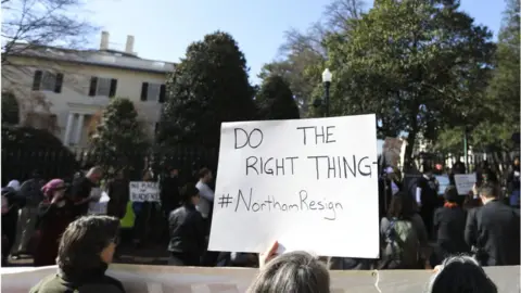 LOGAN CYRUS/AFP/GETTY Protesters outside governors mansion