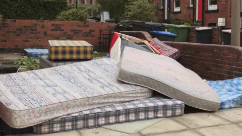 Zero Waste Scotland Mattresses in a communal garden area