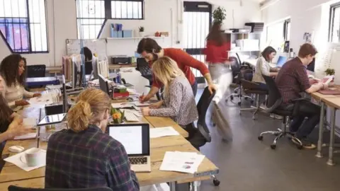 Getty Images People working in an office