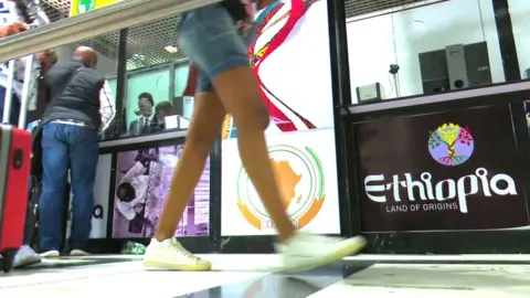 BBC An Ethiopian tourism campaign banner at Addis Ababa Bole International Airport