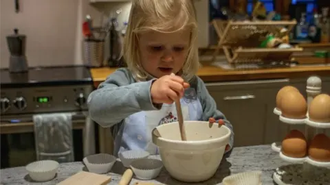 Katherine Rhodes Katherine's daughter Beatrix baking