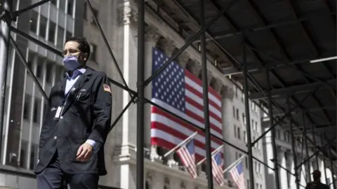 EPA A trader walks past the New York Stock Exchange in New York, New York, USA, on 03 September 2020. The Dow Jones industrial average was down nearly 900 points today