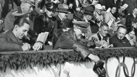 Getty Images Adolf Hitler signs autographs, Winter Olympic Games, Garmisch-Partenkirchen, Germany, 1936