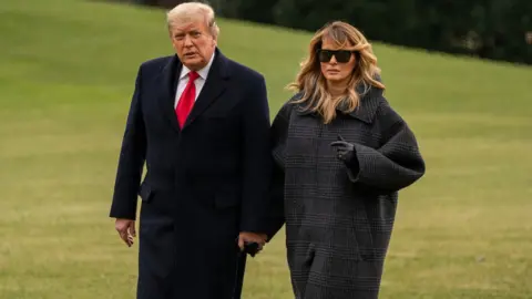 EPA President Trump and First Lady Melania Trump arrive at the White House on 31 December 2020