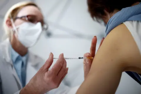 Reuters A vaccination takes place in France