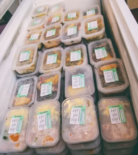 Rusby Media Dozens of boxed meals produced by the charity, ready to hand out