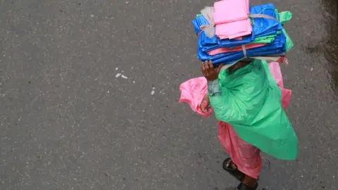 Getty Images A man selling polythene in Dhaka