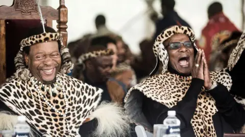 Getty Images Zulu King Goodwill Zwelithini ka Bhekuzulu (L) and senior Prince of the Zulu Nation and former leader of the Inkatha Freedom Party ( IFP ) Prince Mangosuthu Buthelezi (R) join thousands of people to commemorate King Shaka's Day Celebration near the grave of the great Zulu King Shaka at Kwadukuza, some 98 kilometres north of Durban, on September 24, 2019.