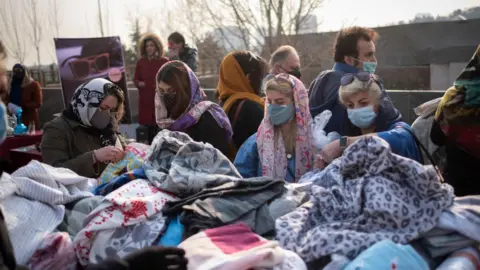 Getty Images Women shopping at a bazaar in Iran