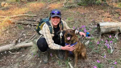Kelsey Sims/US Forest Service Kelsey Sims and her dog, Roo
