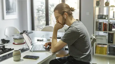 Getty Images Man working from home