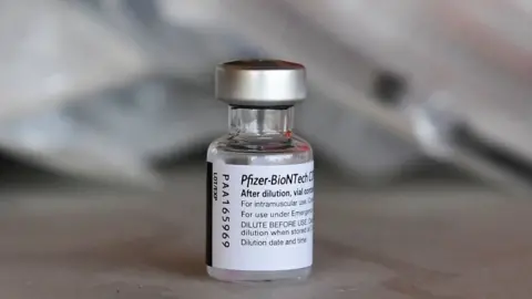 Getty Images Bottle of pfizer jab