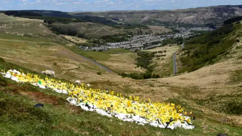 Getty Images A tribute to those who have died from Covid on a mountain overlooking the Rhondda valley