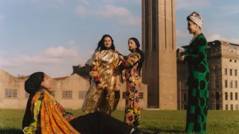 Vivek Vadoliya  Women posing in Asian dress in front of Bradford mills