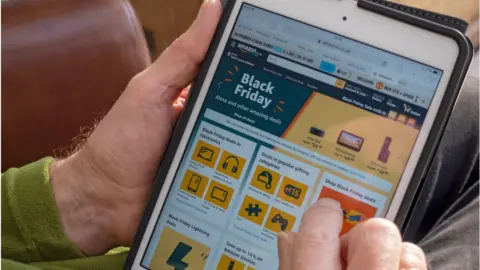 Getty Images A man using Amazon website
