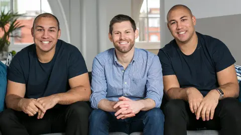 Marshmallow Alexander and Oliver Kent-Braham, with their colleague and co-founder David Goaté