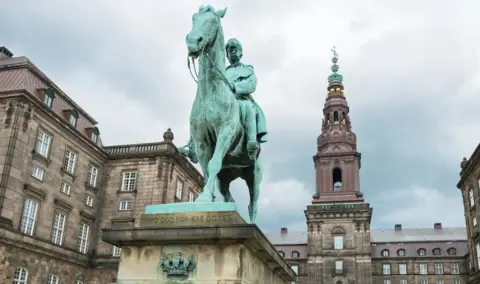 Getty Images Upward View Of The Christianborg Palace With The Monument Of King Cristian Ix In The Foreground.