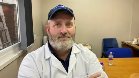 Tom Newton, owner of Coquet Island Shellfish Company, in his office