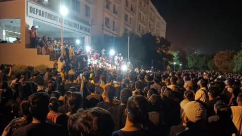 BBC Crowd gathered outside the Department of Student Welfare